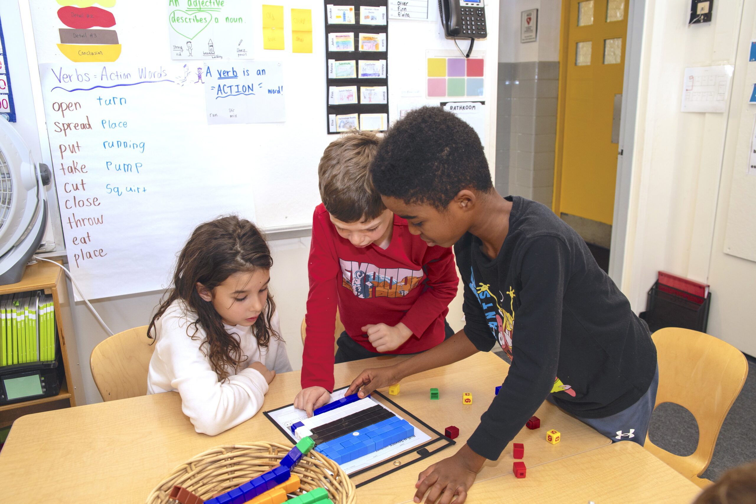 Lower School students collaborating on a project in a small group setting